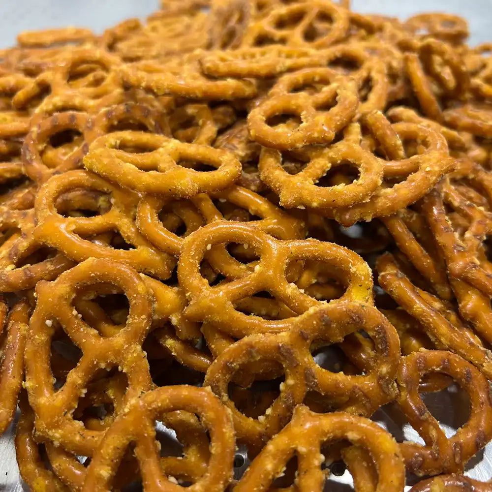 Spicy pickle pretzels showing seasoned coating in close-up